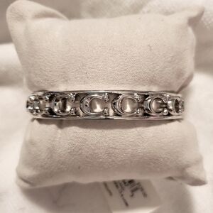 Coach Silver Bangle with Intricate Design and Gemstone Accents